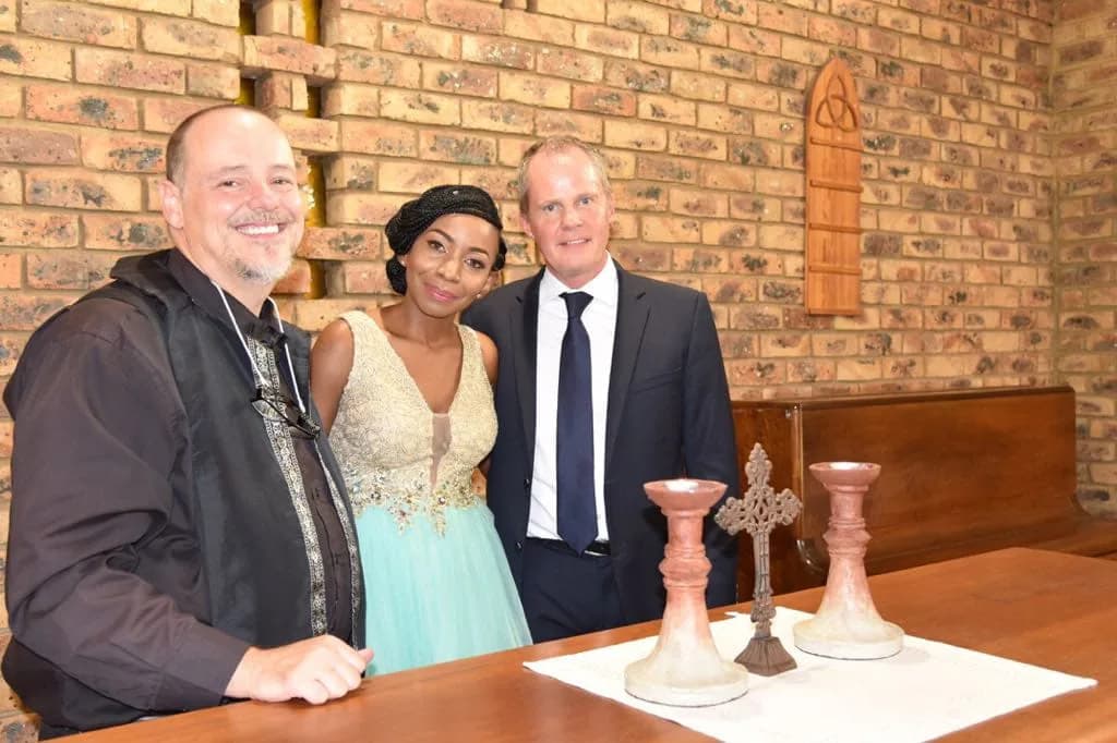 Marriage officer Dr Heinrich Lottering with newlyweds in the chapel